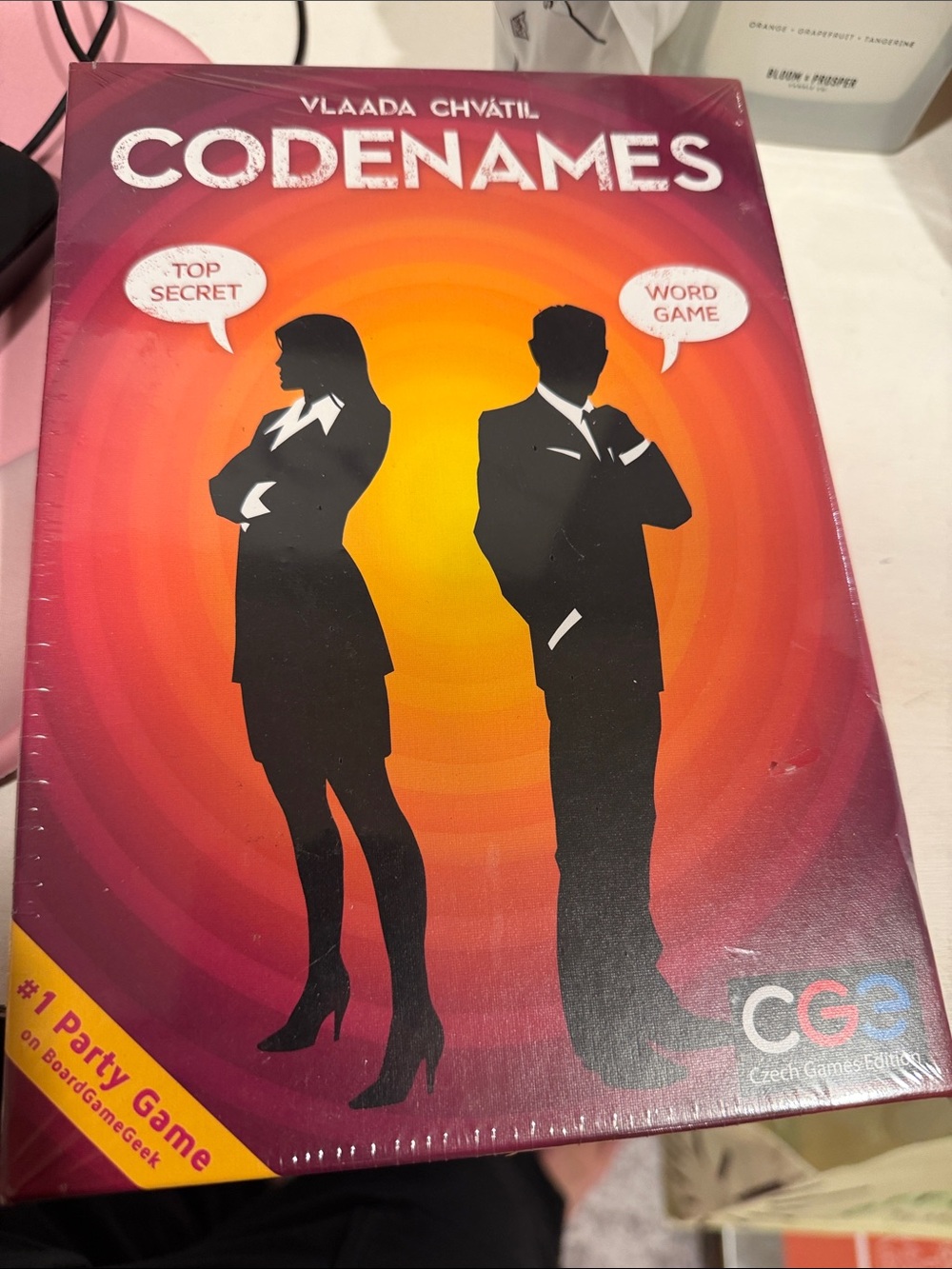 Codenames Party Word Game - Red/Orange Gradient sealed package